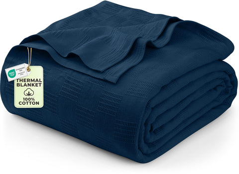 Utopia Bedding navy thermal blanket on bed offers breathable comfort.