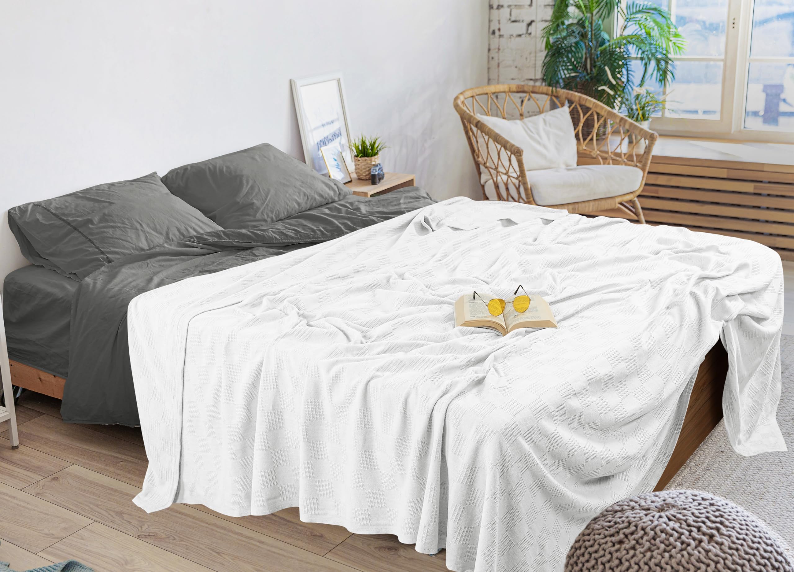 Utopia Bedding blanket spread on bed showing oversized fit and shrinkage compensation.