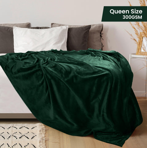 Utopia Bedding queen-size forest green blanket folded for bedside warmth.