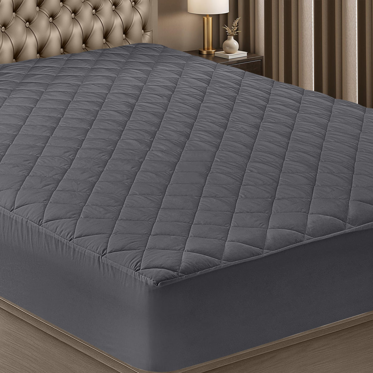 Utopia Bedding quilted fitted mattress pad on king bed, plush softness and secure fit.