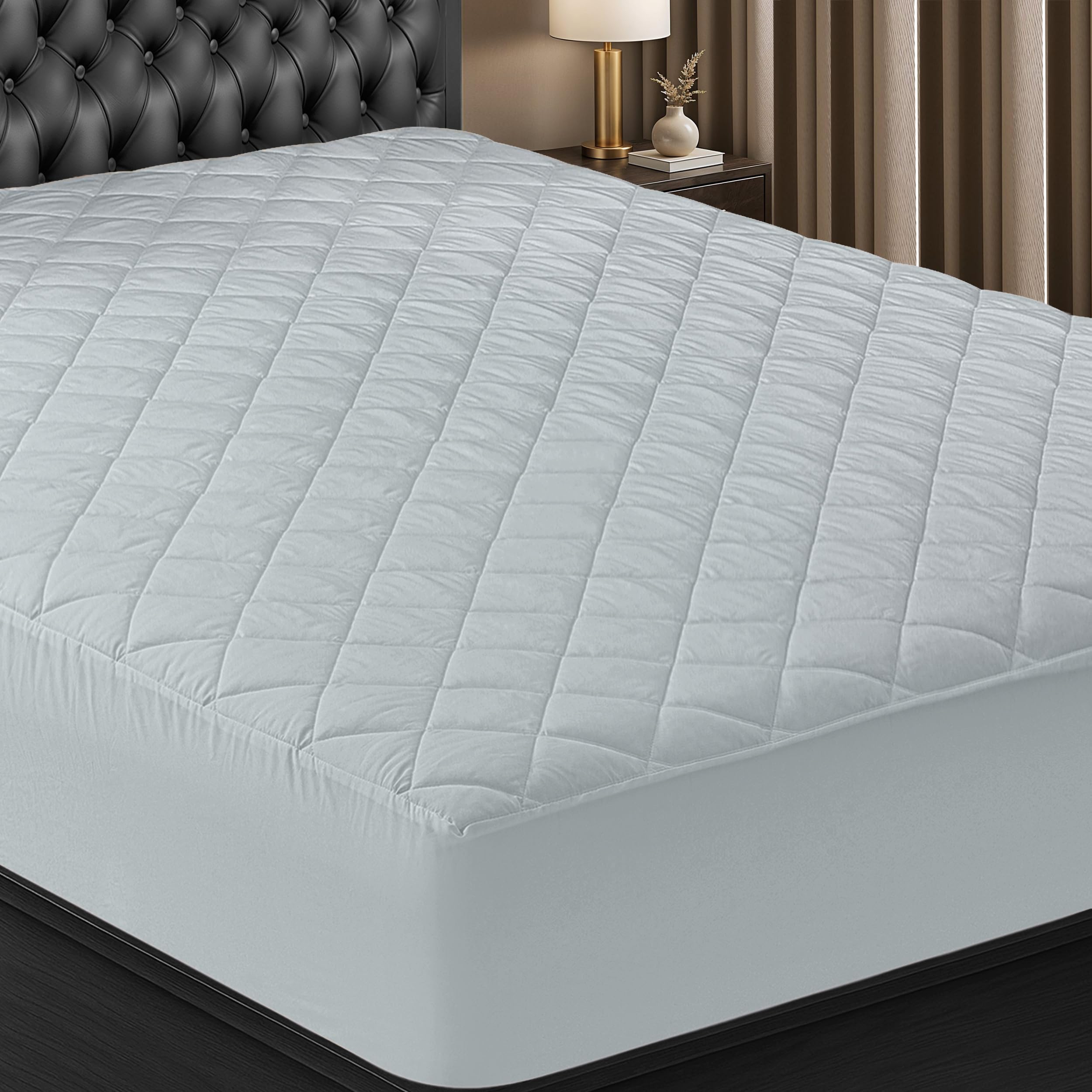 Utopia Bedding quilted fitted mattress pad offers plush comfort with a secure elastic fit.