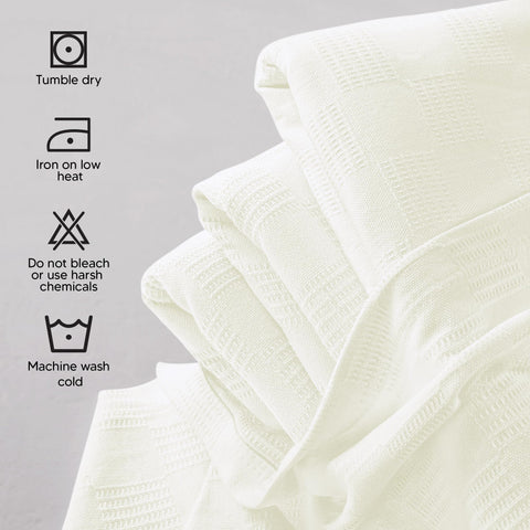 Utopia Bedding thermal blanket on a bed, breathable and lightweight