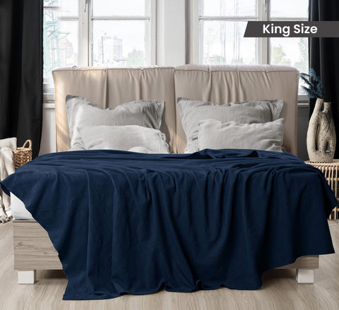 Utopia Bedding thermal blanket draped on couch adds cozy warmth.