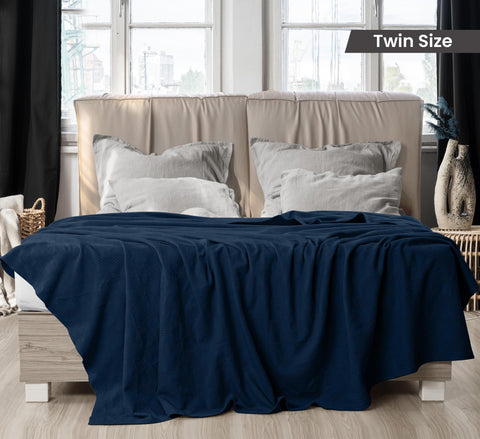 Utopia Bedding navy thermal blanket spread over a sofa for cozy evenings.