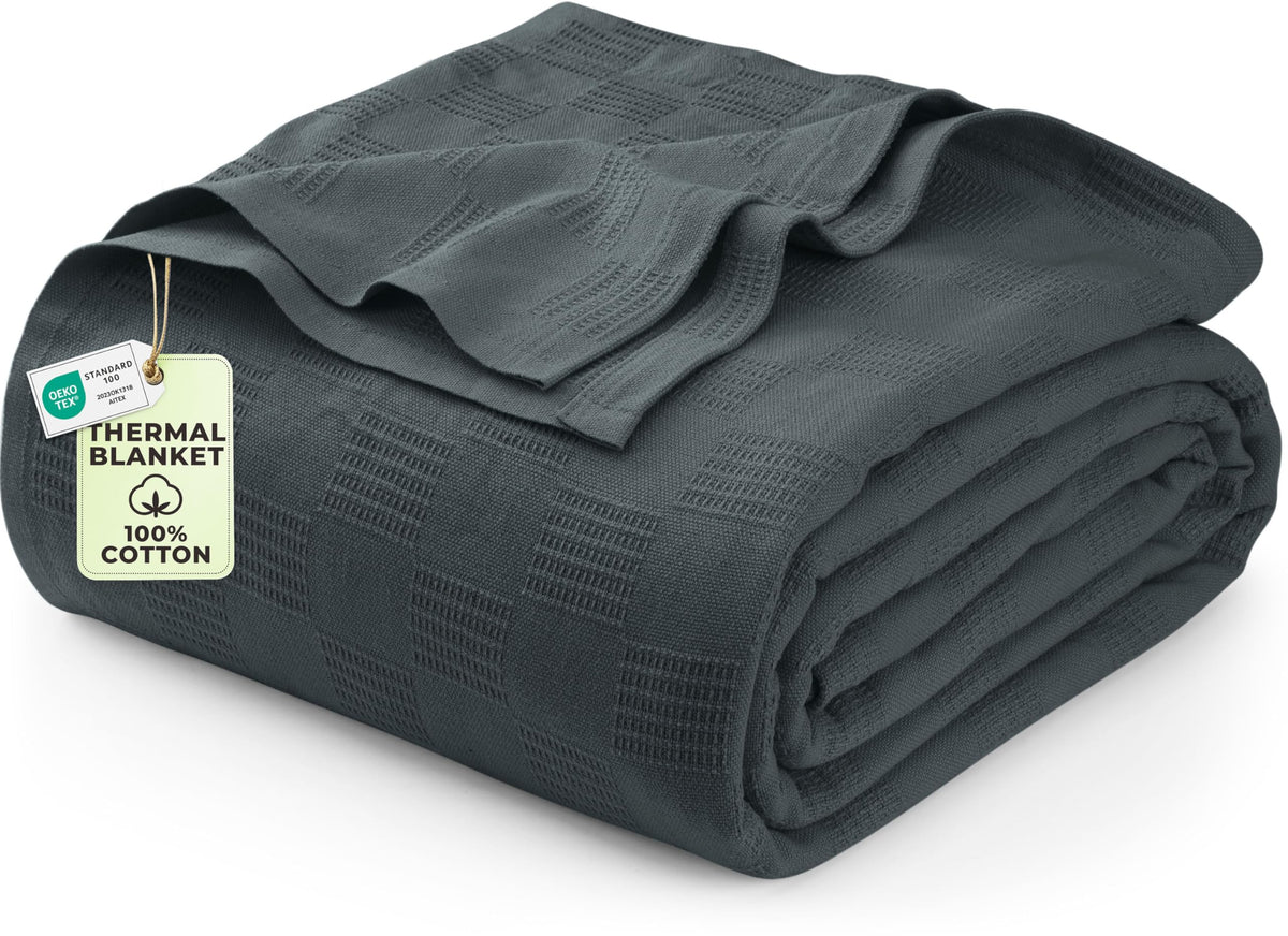 Utopia Bedding thermal blanket smoke gray draped on couch for cozy evenings.