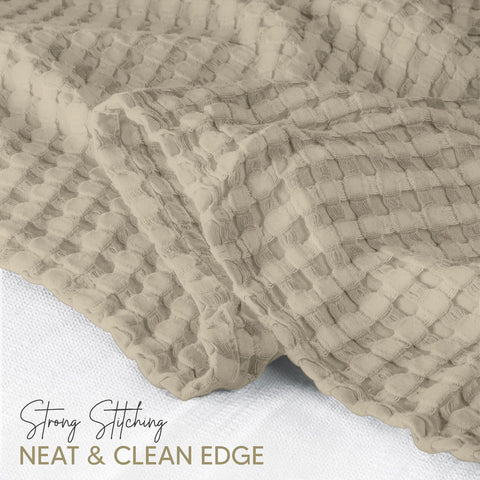 Utopia Bedding waffle blanket draped for a light, airy feel.