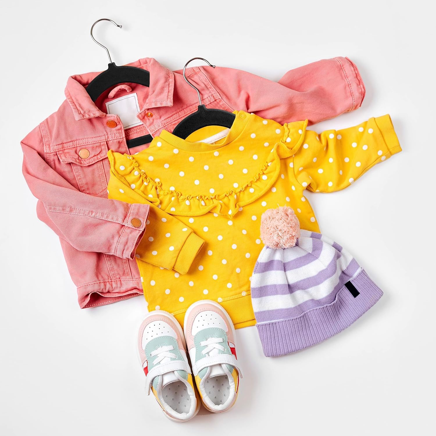 Utopia Home 11-inch hangers organize onesies and dresses with minimal effort.