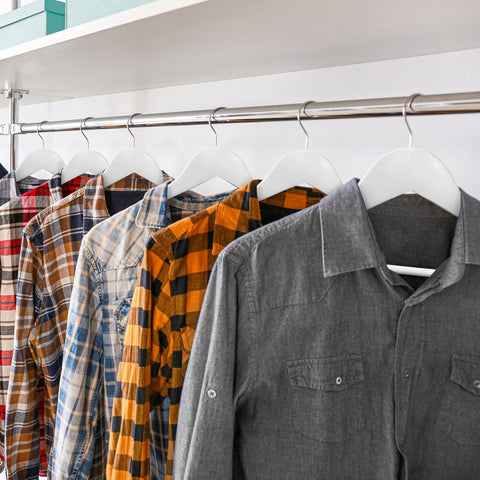 Utopia Home closet-organization solution with wooden hangers keeping shirts and pants neatly arranged