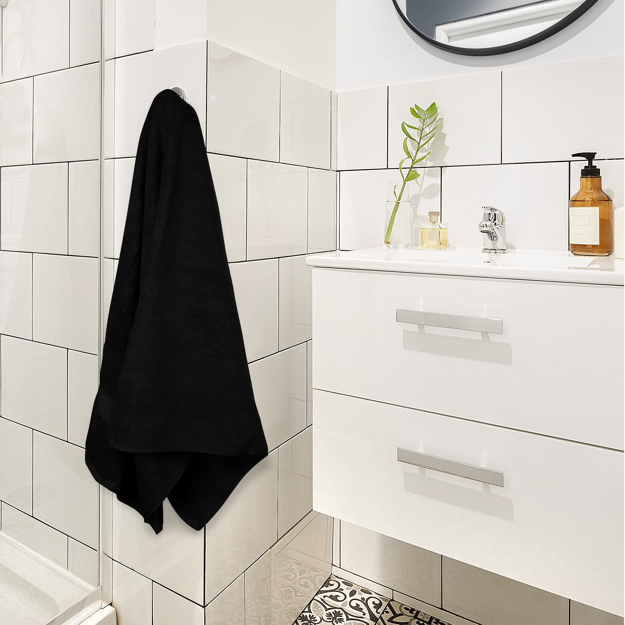 Utopia Towels 4Pack black bath towels drying test showing fast absorption.