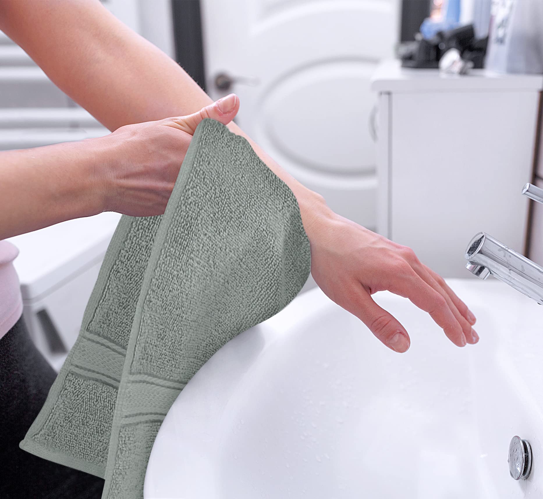 Utopia Towels absorbent, soft fabric shown in use on a hand towel.
