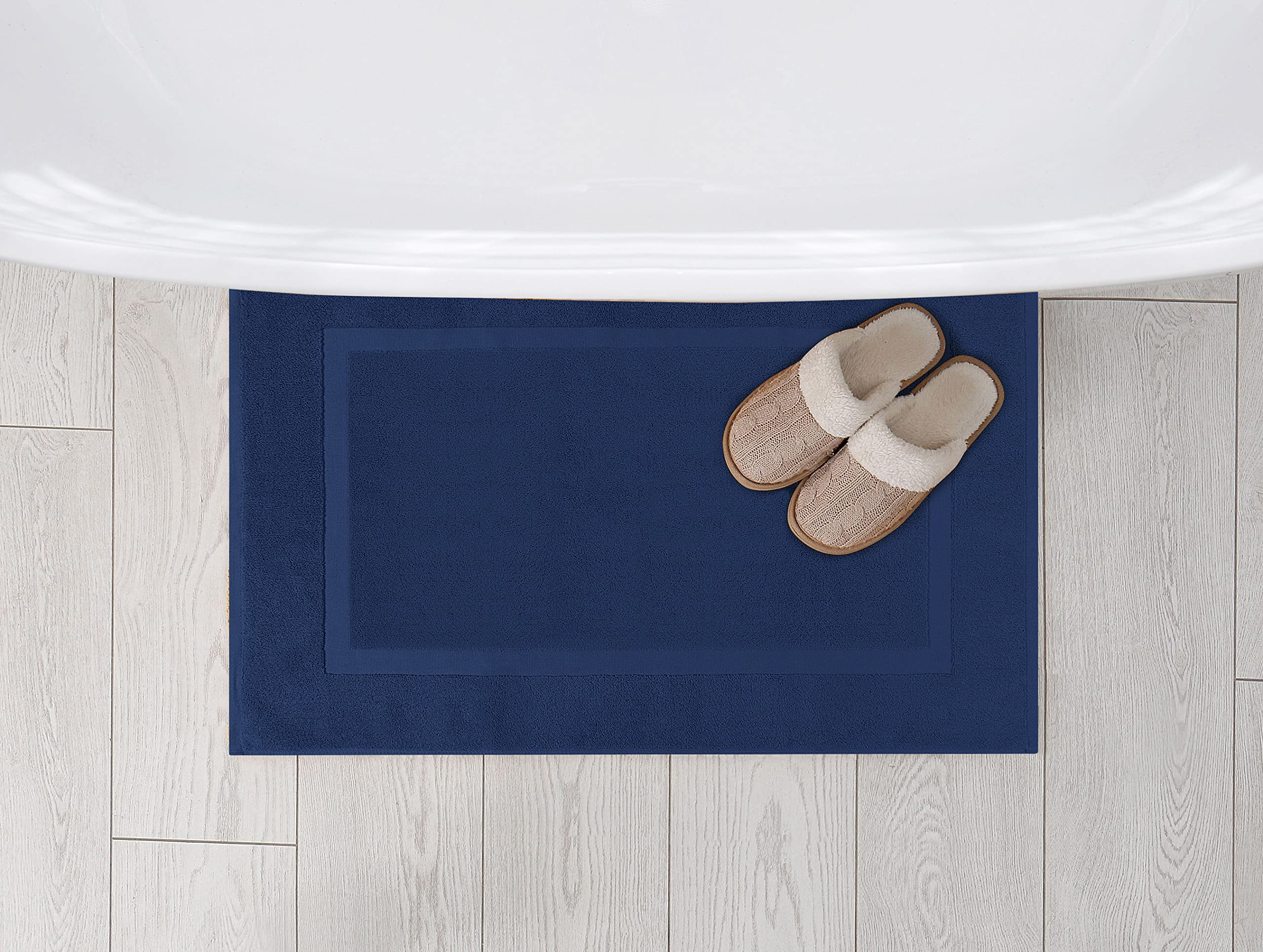Utopia Towels machine washable and dryer-friendly bath mat near shower
