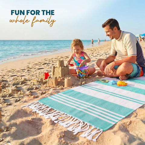 Utopia Towels cool-grey color option complements neutral beach outfits.