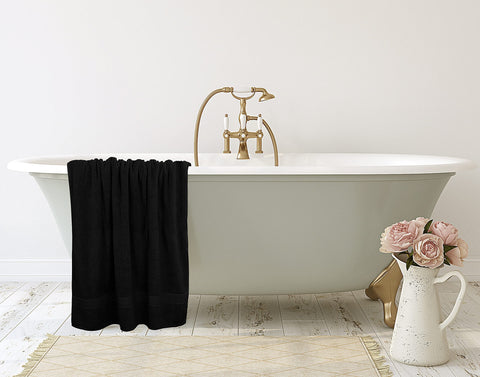 Large bath sheet draped over a chair showing generous coverage.