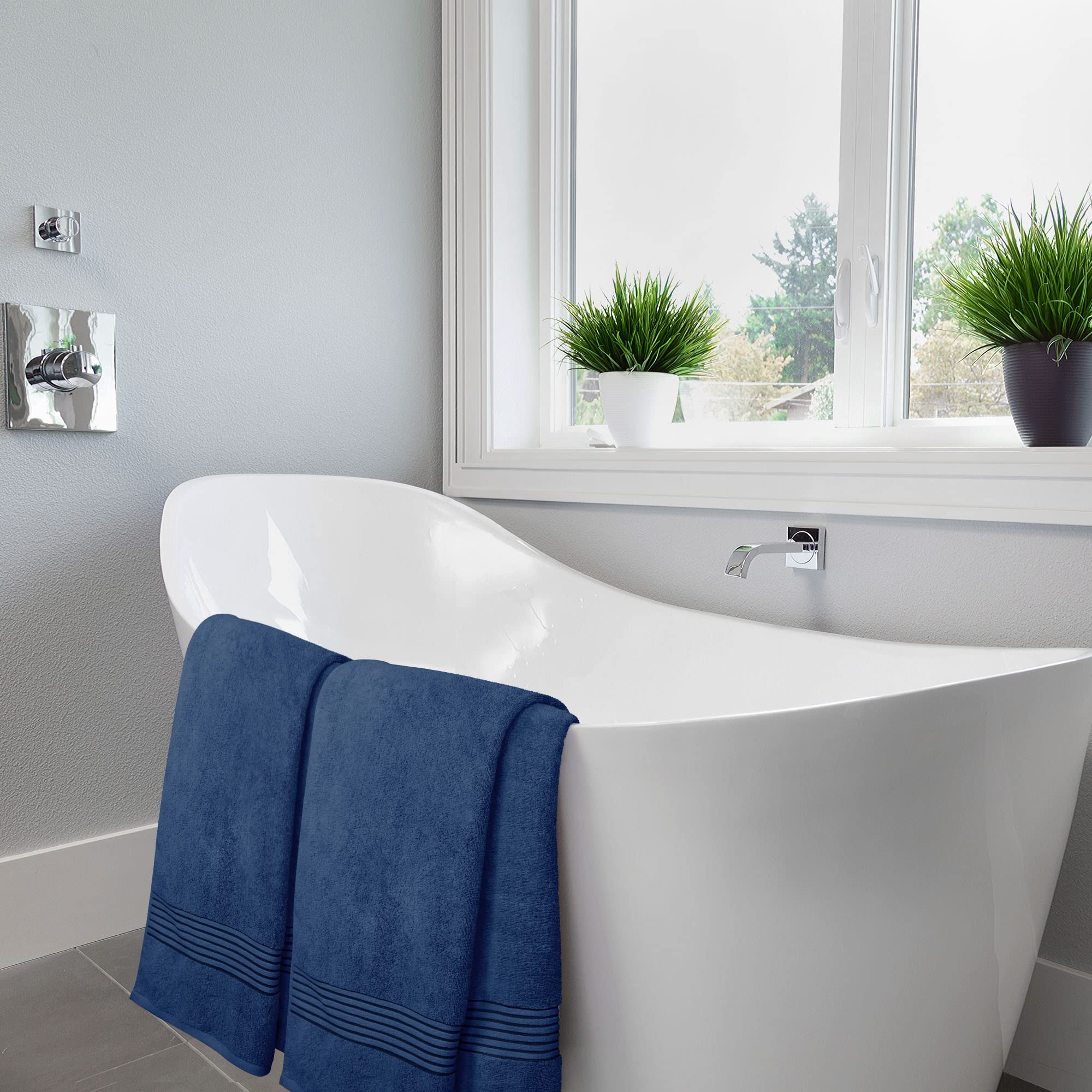 Utopia Towels navy bath towels in bathroom setting for daily use.