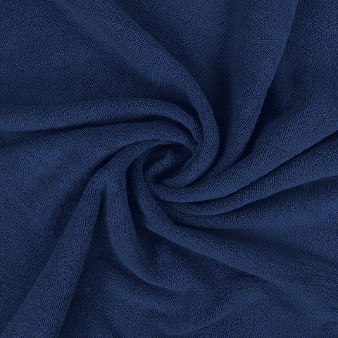 Lifestyle shot shows wrapping the jumbo towel after shower with natural movement