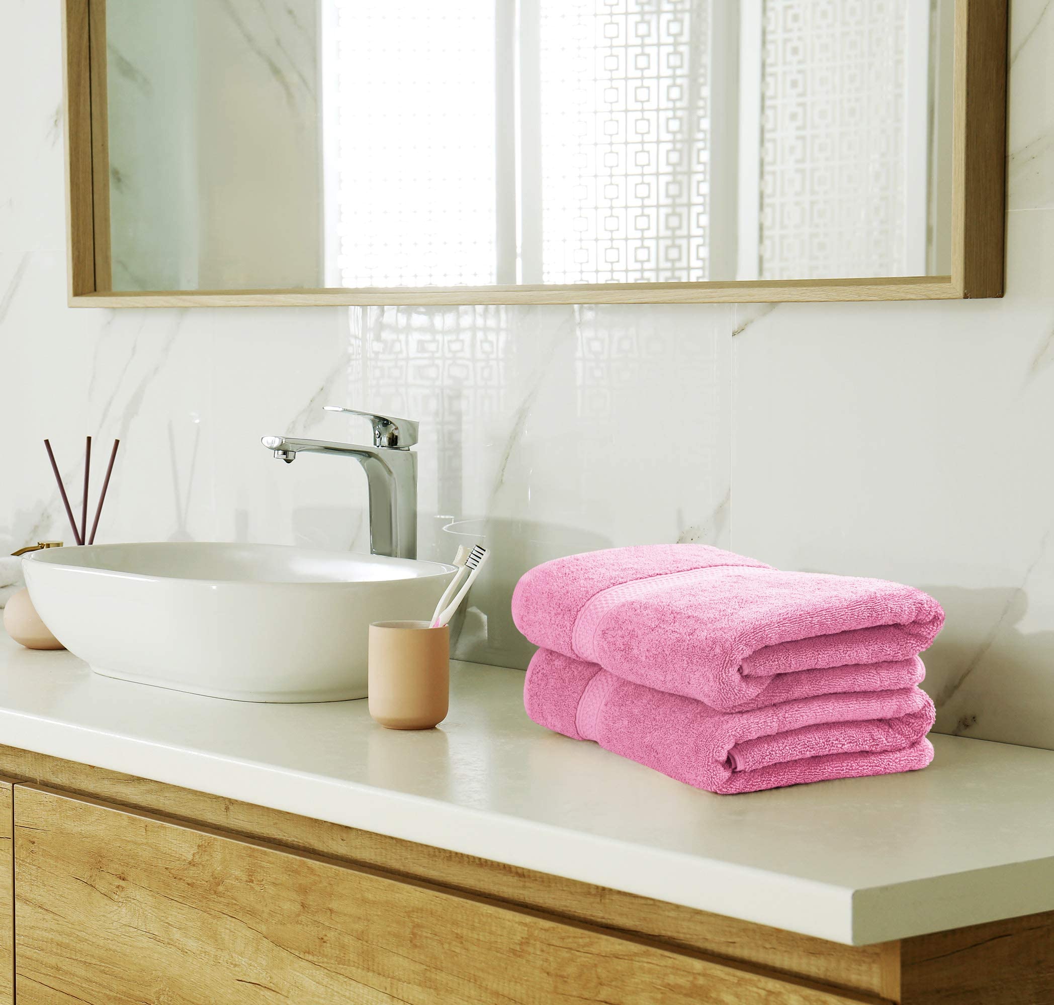 Utopia Towels washcloth pink laid flat showing even stitching and premium quality.