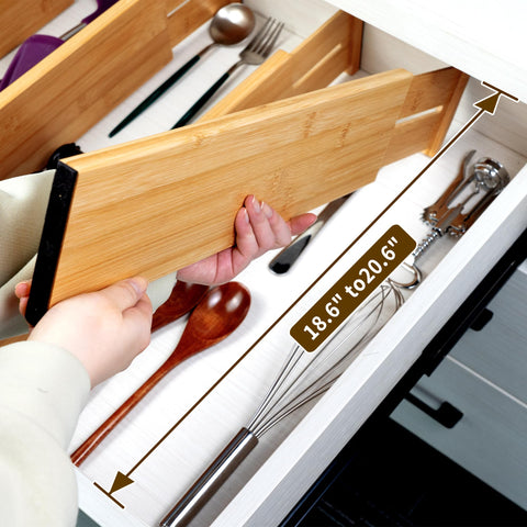 Utoplike spring-loaded divider holds cosmetics securely in place