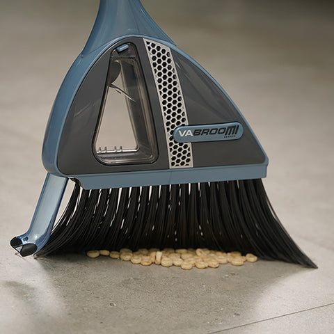 VaBroom built-in vacuum nozzle capturing dust and small debris efficiently