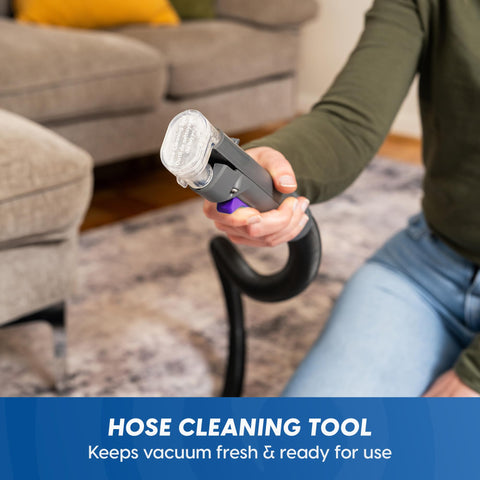 Vacmaster SCB1001H 21-foot reach testing cleaning around a sofa