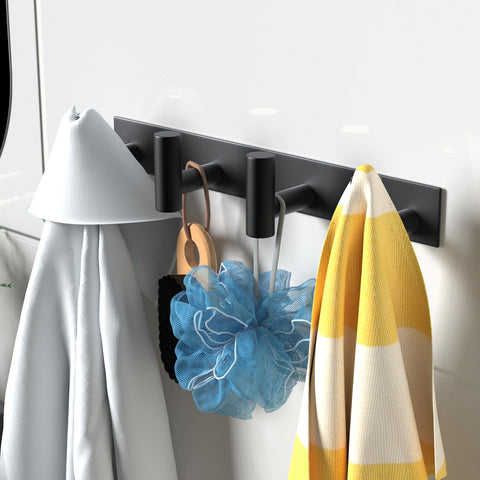 VAEHOLD bathroom towel organizer demonstrating efficient spacing to keep towels fresh