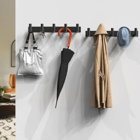 VAEHOLD bathroom towels hung on five hooks for organized space.