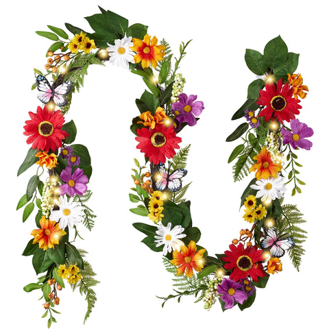 Valery Madelyn 6ft spring garland on the mantel with daisies and butterflies, warm glow.