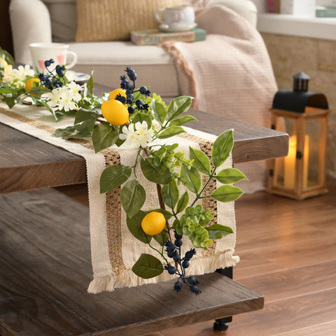 Battery-powered warm white LEDs illuminate lemons and berries for cozy evenings.