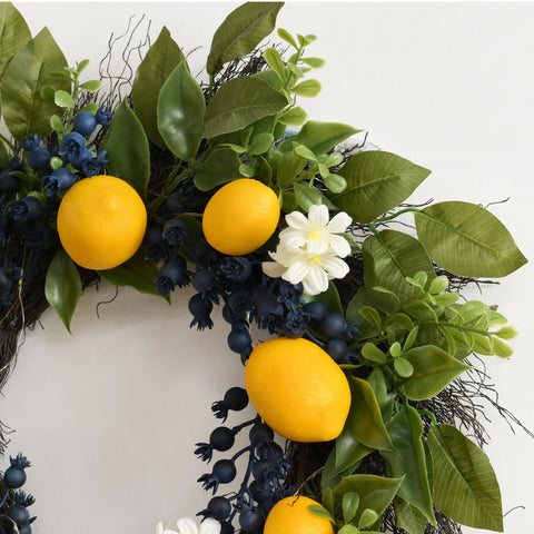 Wreath styled as a wall centerpiece for a farmhouse-inspired lemon vignette by Valery Madelyn.