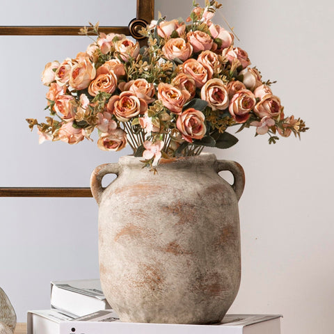 Vanselia ceramic flower vase in farmhouse style complements living room shelves.