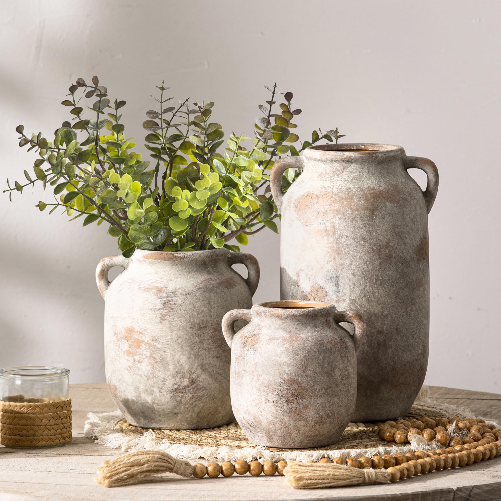 Vanselia ceramic flower vase with waterproof interior for fresh or faux arrangements.