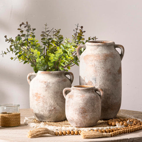 Vanselia ceramic flower vase with waterproof interior for fresh or faux arrangements.