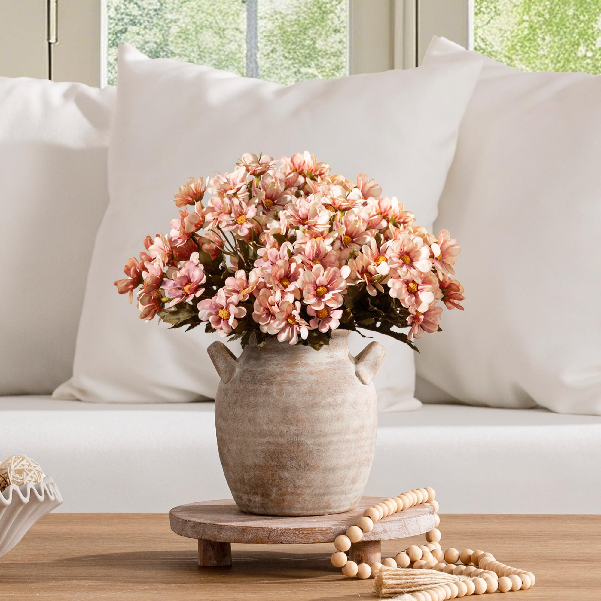 Vanselia ceramic vase on bookshelf complements rustic decor.