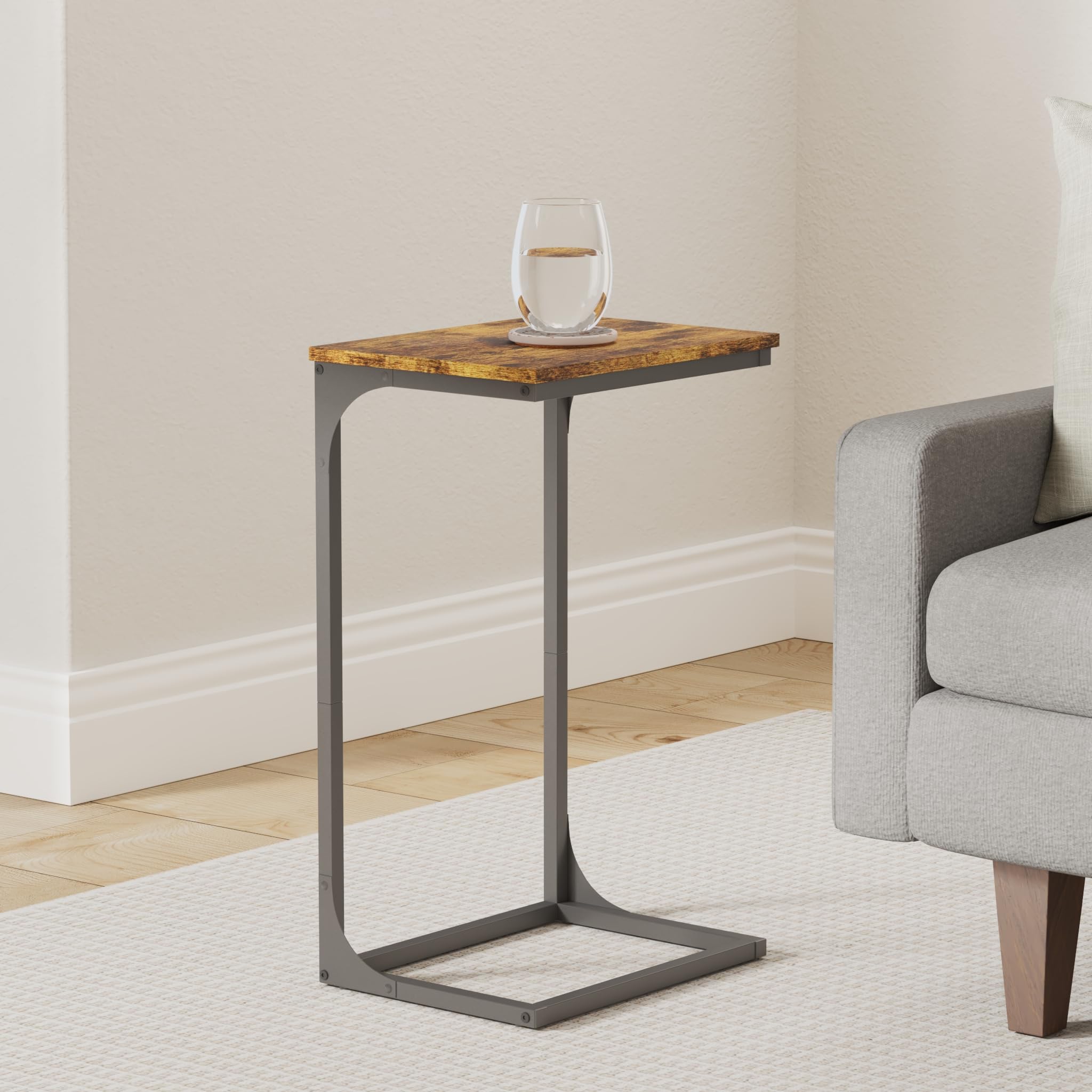 VASAGLE C-shaped end table over the sofa arm for quick snacks and devices.