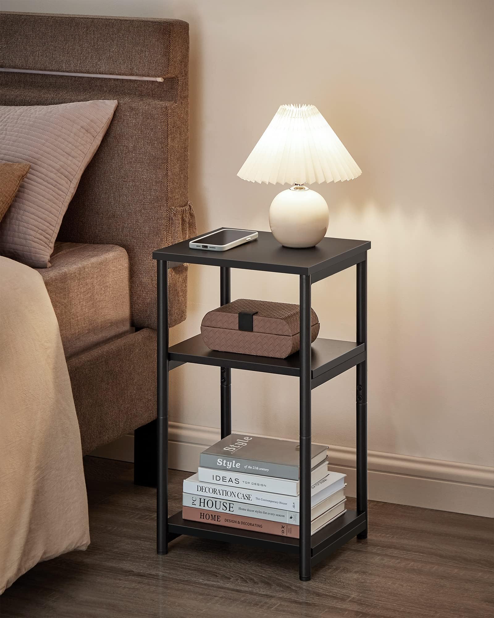 VASAGLE tall nightstand with matte black frame beside the bed.