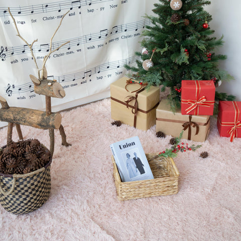 VATIMA wicker basket with wooden handles for easy transport around the home.