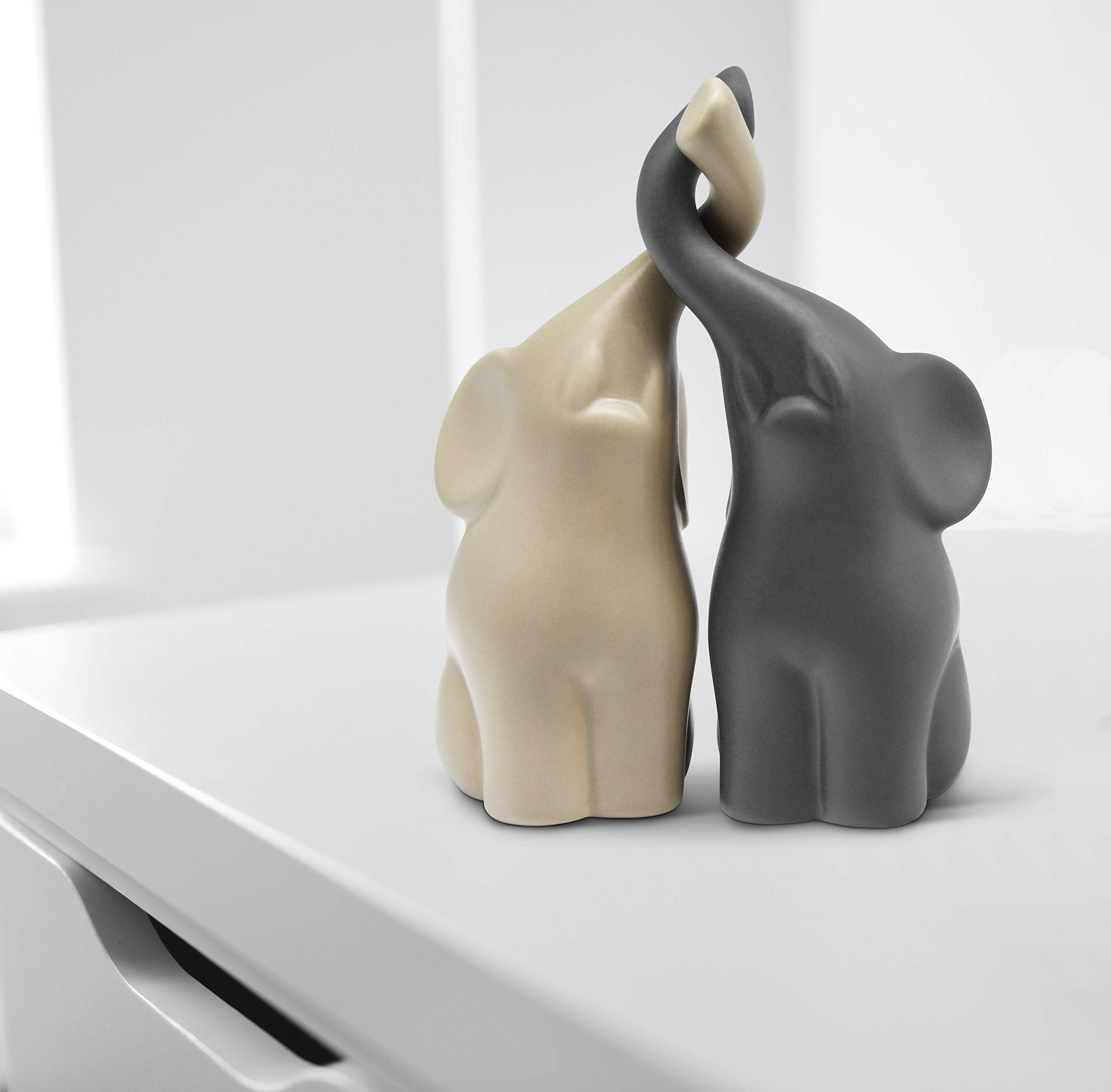 Vaudagio elephants face-detail showcases artisanal charm for focal shelf display.