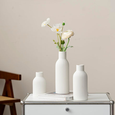 Vaurcesa set of 3 ribbed white vases makes a lovely gift.