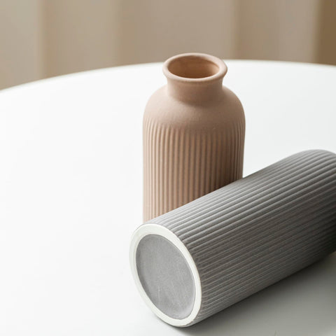 Vaurcesa office desk decor using elegant vases.