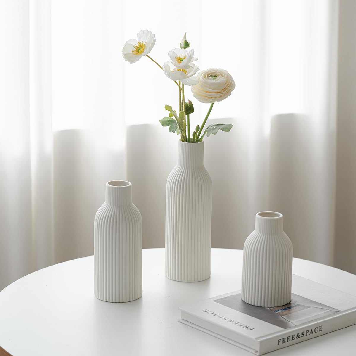 Vaurcesa white matte vases for versatile styling on mantels and tables.