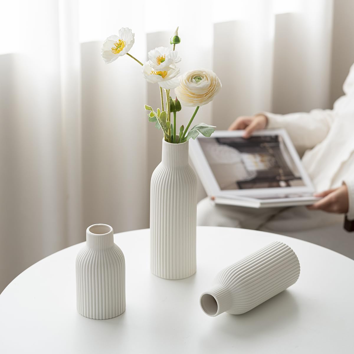 Vaurcesa waterproof-coated vases support fresh stems or dried arrangements.