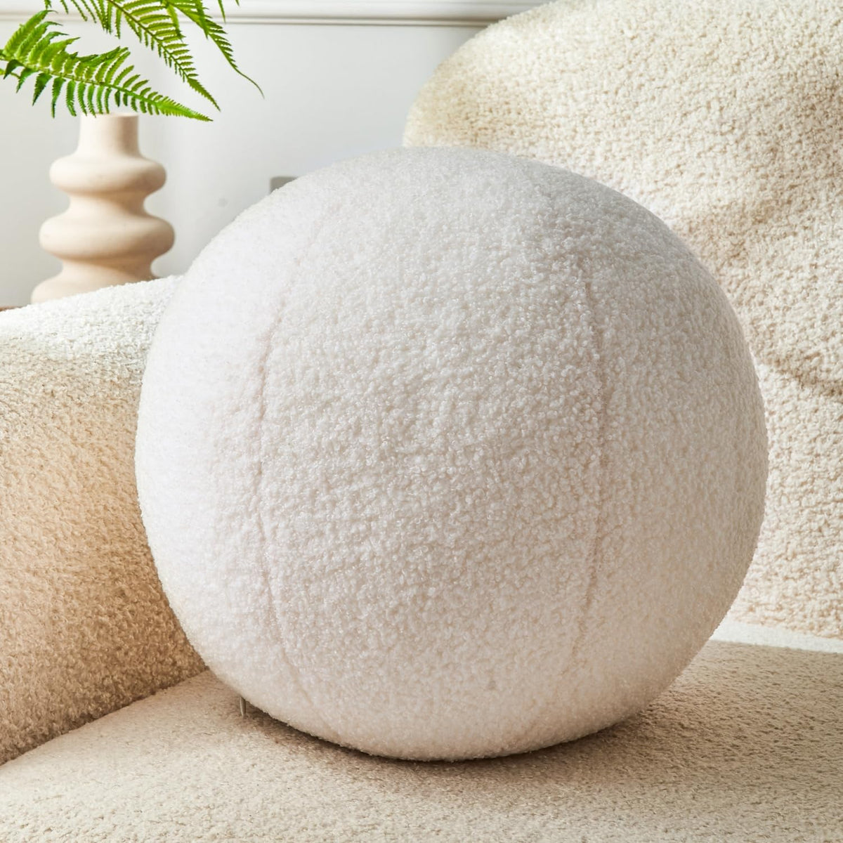 Vdoioe Cream White Ball Pillow 11.8-inch with plush surface for the sofa.