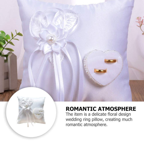 Veemoon ring bearer pillow on ceremony table capturing a graceful moment