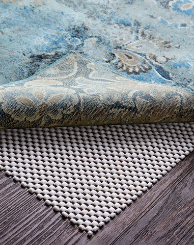 Veken rug pad gripper securing a 5x8 ft rug on a hardwood floor