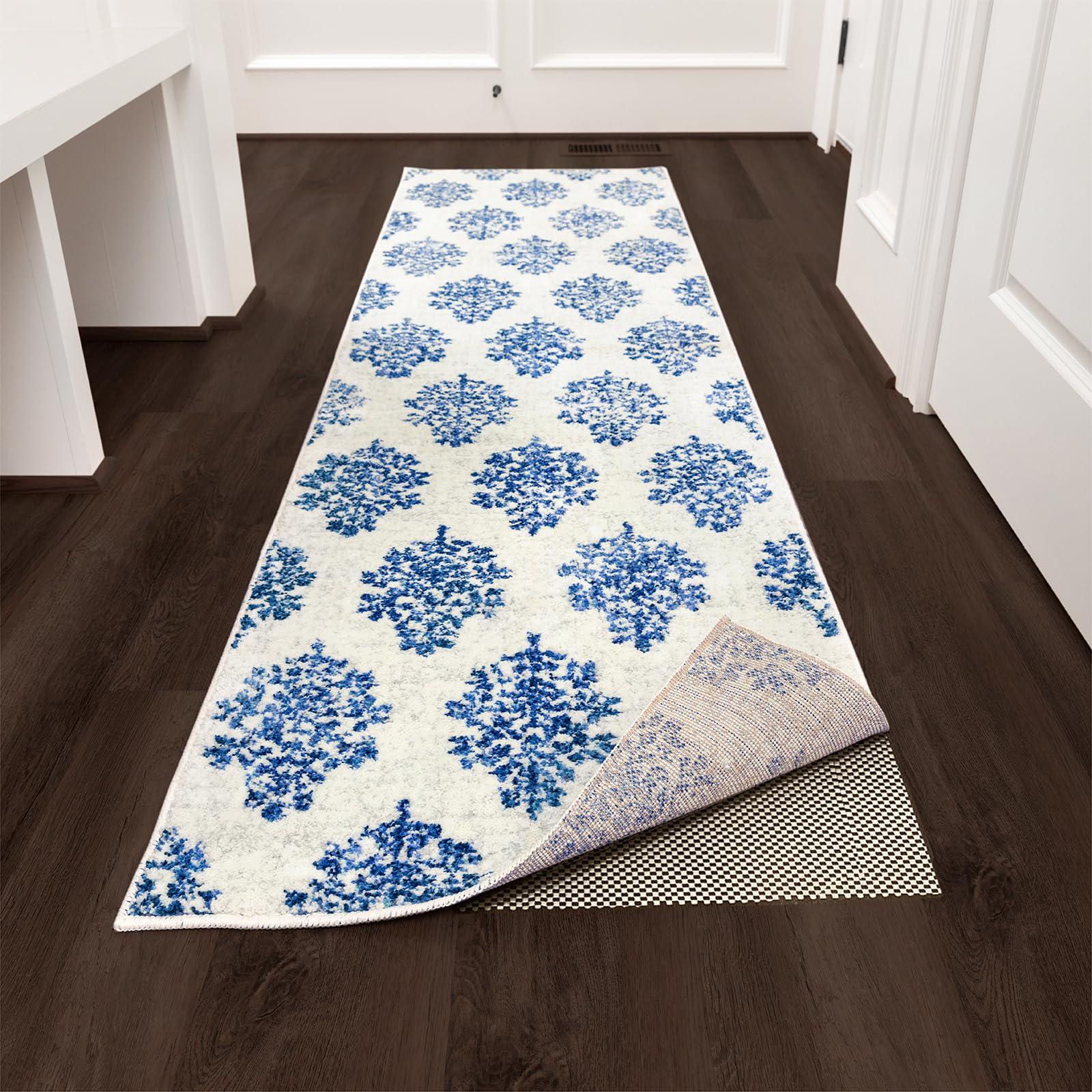 Open grid design of the Veken rug pad supports airflow under rugs.
