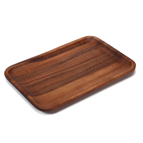 Velinjowy Serving Tray on dining ottoman creates warm, organized ambiance.