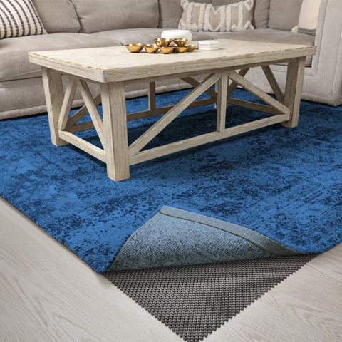 Dark grey Veken rug pad protects floors from wear and tear.