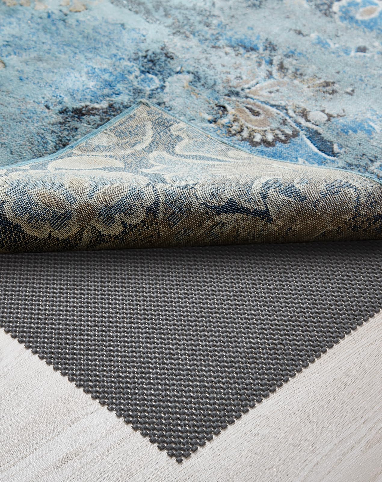 Veken rug pad gripper on hardwood floor keeps rugs securely in place.