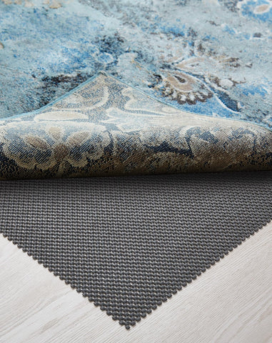 Veken rug pad gripper on hardwood floor keeps rugs securely in place.