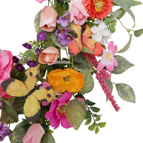 VGIA spring wreath hung over sofa for cozy interior charm