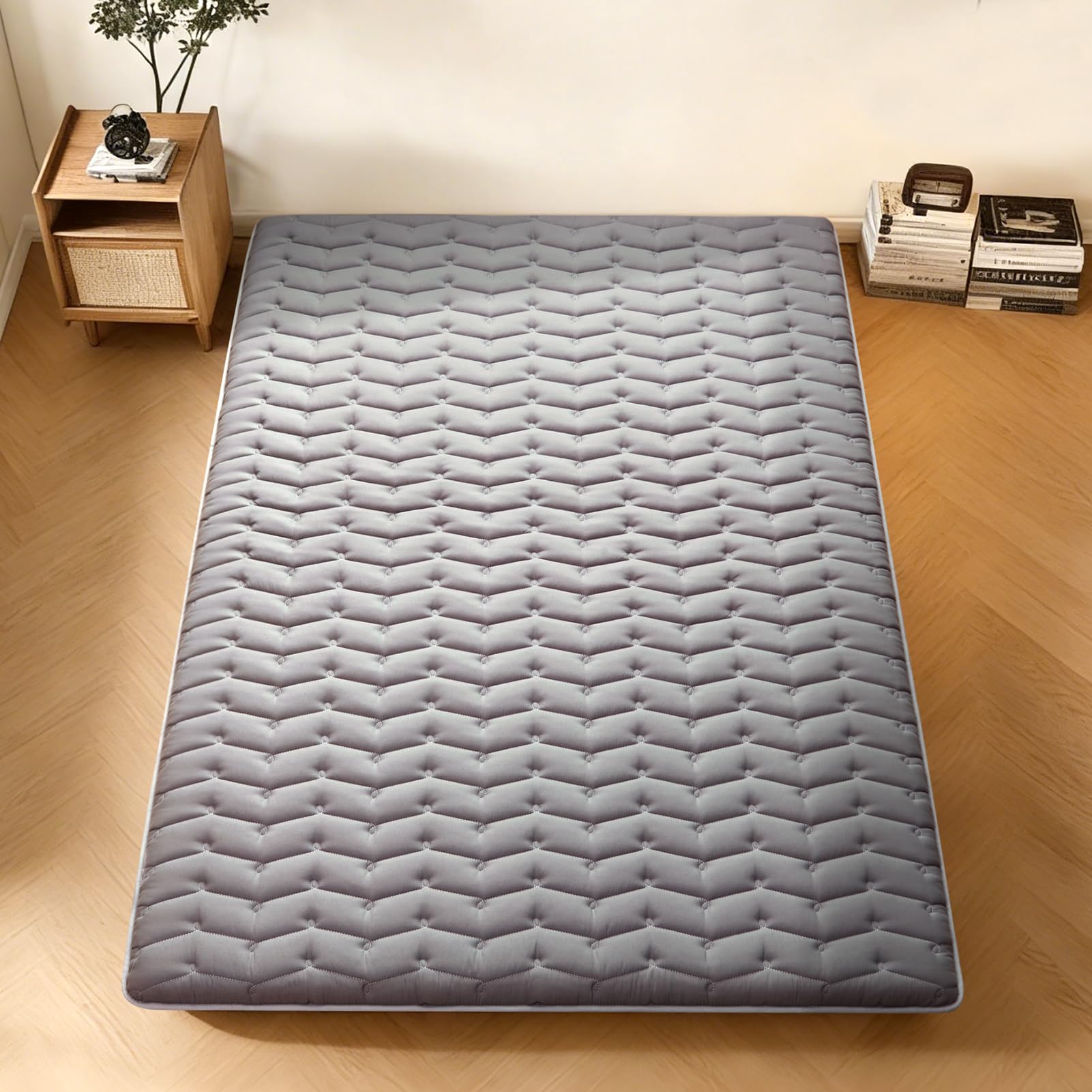 Vibe Bear portable floor mattress rolled for travel or guests.